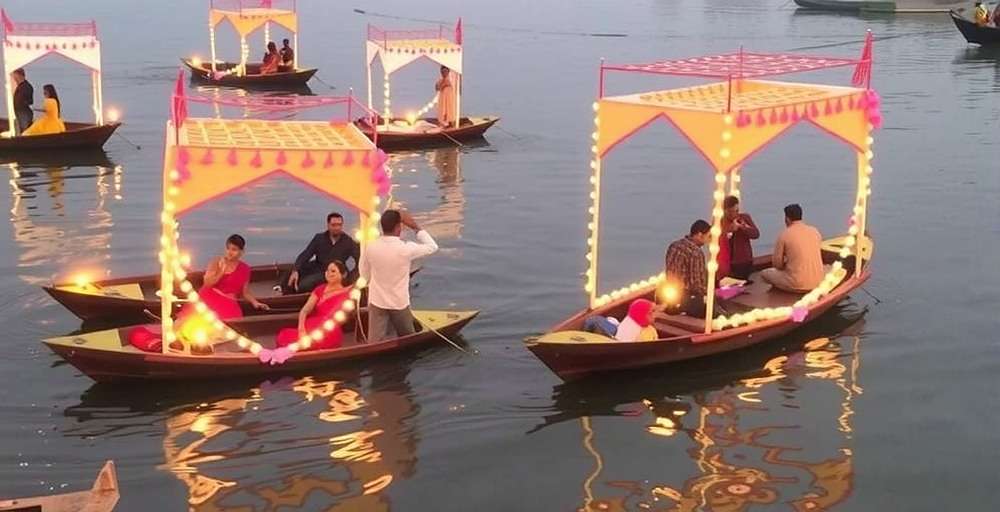 Diwali celebration in Ganga Gold Grabbers Ganga Gold Grabbers Diwali event showing decorated boats with diyas on the Ganges